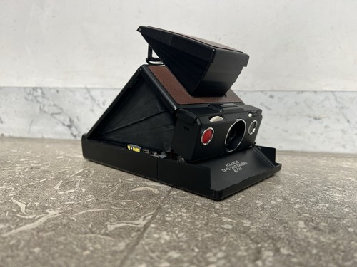 Polaroid nera testata - sx,