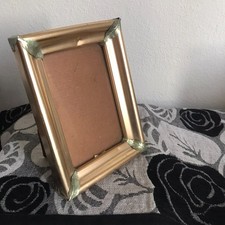 Portafoto vintage decorato con foglie verdi