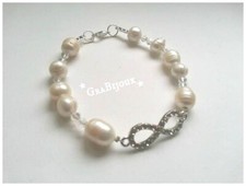 Bracciale pietre di fiume mezzi cristalli e ciondolo infinito