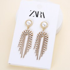 Zara orecchini nappa