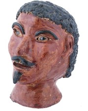 Antica scultura testa in