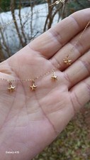 Collanina in Oro 9 carati ( Punzonatura 375) Con 5 Ciondolini A Forma Di Stella