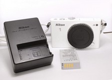 Nikon 1 J4 solo corpo fotocamera 18Mp Wi-Fi Touch FullHD con 3000 scatti