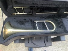 Trombone Comet con astuccio originale e componenti.