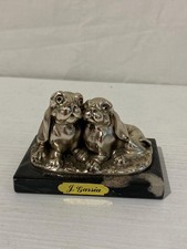 Coppia di cani in bronzo