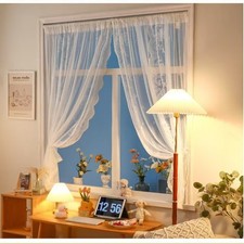 Tende in pizzo bianco ricamate