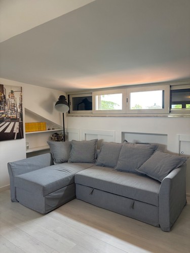 Divano letto angolare grigio