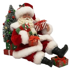 Babbo Natale da collezione seduto a terra con regali 18cm