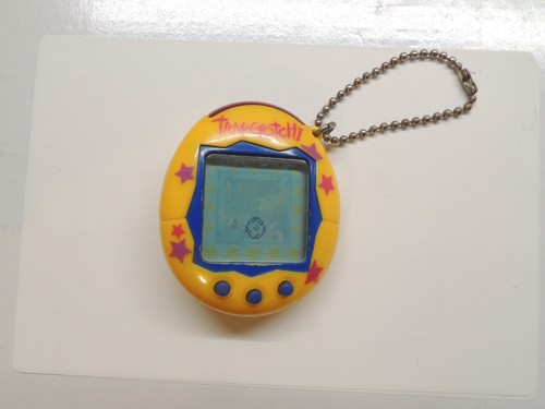 Tamagotchi jaune etoiles - tamagotchi,