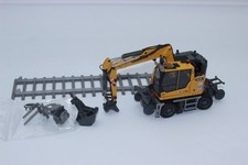 Escavatore bidirezionale Conrad 2237 Liebherr RE 25 Rail Road 1:50 NUOVO IMBALLO ORIGINALE escavatore