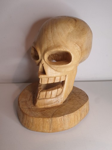 Hand carved wooden human - hand, skull