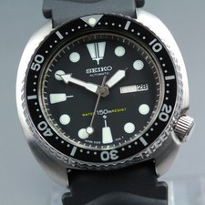 [Inglese e Arabo] Orologio AT