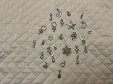 Set 27 ciondoli metallo argentato zirconi