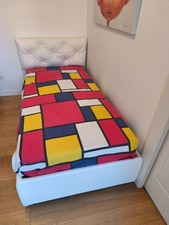 Letto singolo imbottito ecopelle(1,06x2,00) con rete a doghe e materasso a molle