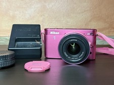 **LEGGI** Nikon 1 J2 rosa con obiettivo 1 NIKKOR 10-30mm f/3.5-5.6 VR Mirrorless