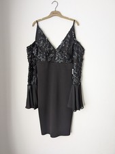 Abito da cocktail nero con paillettes impreziosito manica a campana taglia 10