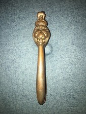 Vintage brass lion wearing