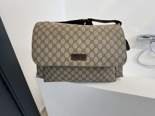 Gucci baby diaper changing - baby,