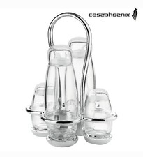 Un set olio aceto sale e pepe composta da ampolle in vetro, un dosatore tagliago