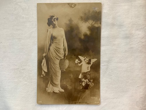 Lady standing next child - to, a