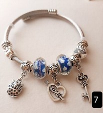 BRACCIALE IN ACCIAIO INOSSIDABILE CON CIONDOLI E SFERE VARI COLORI