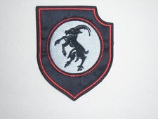 TOPPA RICAMATA IN METALLO NERO