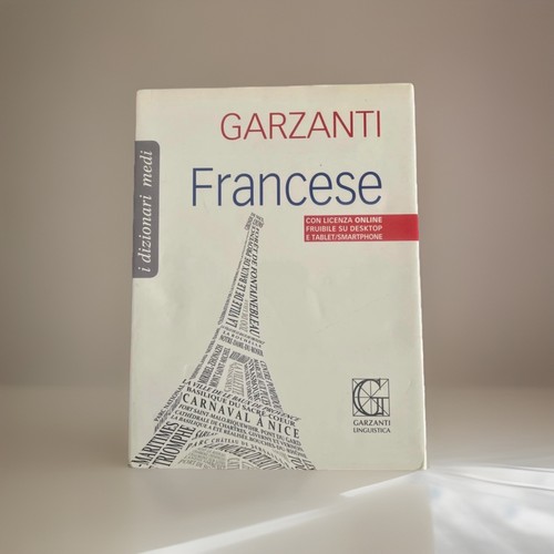Dizionario medio - , di