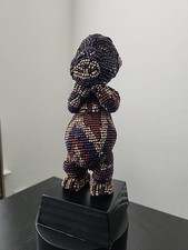 Statua Mupo con perline.