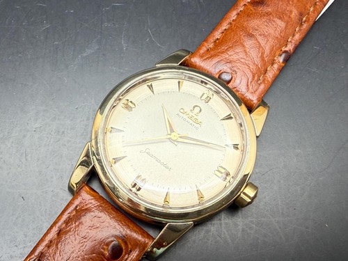 1958 gold capped omega - capped,