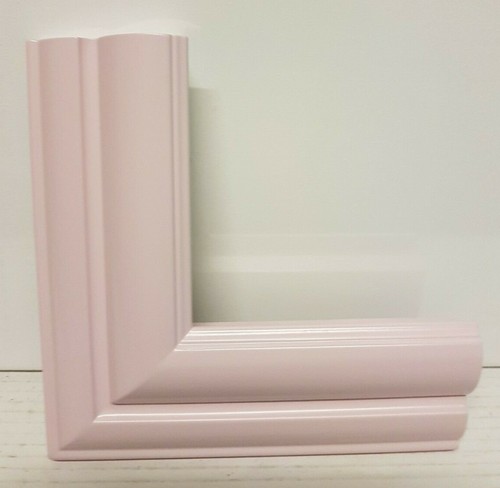 Cornice legno rosa cipria - in,