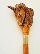 Bastone - Fusto in Legno - Imp. in Legno: testa di unicorno - fascetta e puntale