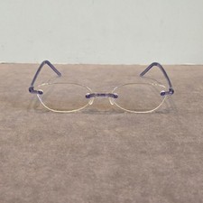 SWISSFLEX Rimless purple eyeglasses gently worn