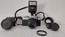 MINOLTA XG9 CON OB. I,7/50 + 2.8/35mm grandangolo  e accessori vari