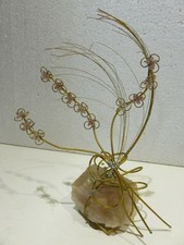 scultura in metallo e quarzo