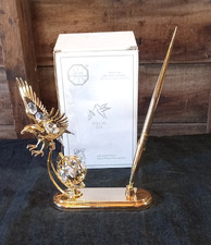 Statuina e penna KG & C INC