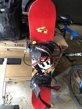 Snowboard And 2 Pair Of Boots