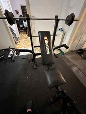 panca pettorali buono stato completa di pesi e bilanciere
