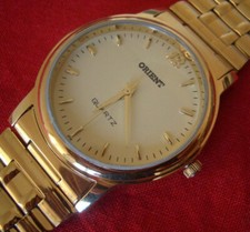 OROLOGIO ORIENT PLACCA ORO GIALLO  MOV. QUARZO  COMPLETO DI  BRACCIALETTO !