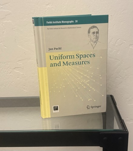 Uniform spaces and measures - and, by