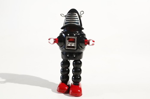 Black planet robot tin toy - black,