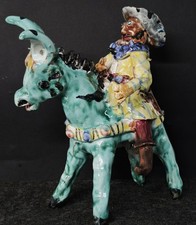 Asino con contadino in