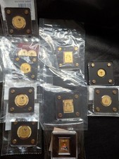 9 lingotti/monete d'oro (pin