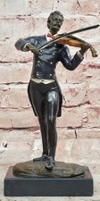Statuina bronzo musicista