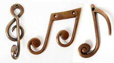 Ganci parete ottone - da, in