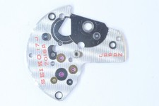 Seiko 112-063 Barrel train-wheel bridge 7016A - 17J NOS