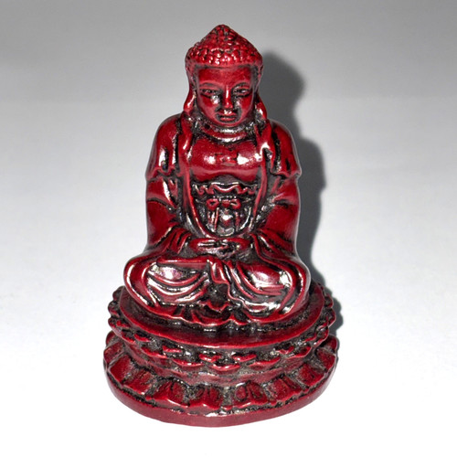 Red meditating buddha figurine - meditating,