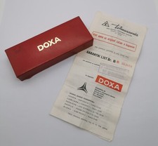 Doxa  Rare 1978 vintage red leather and plastic watch box with warranty paper