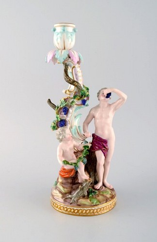 Antico candelabro figurativo