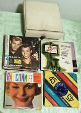 Lotto 34 dischi 45 giri + raccoglitore: SANTO e JOHNNY, RAY CONNIFF, ORCHESTRE