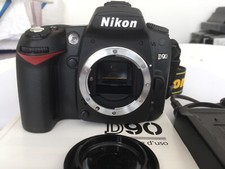 Nikon D90 solo corpo con batteria di ricambio, manuali e caricabatteria